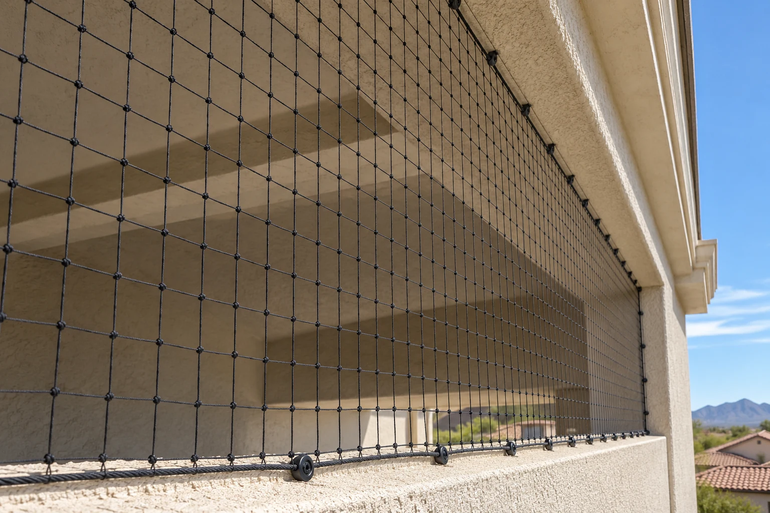 Black bird netting enclosing a recessed stucco canopy to limit pigeon access